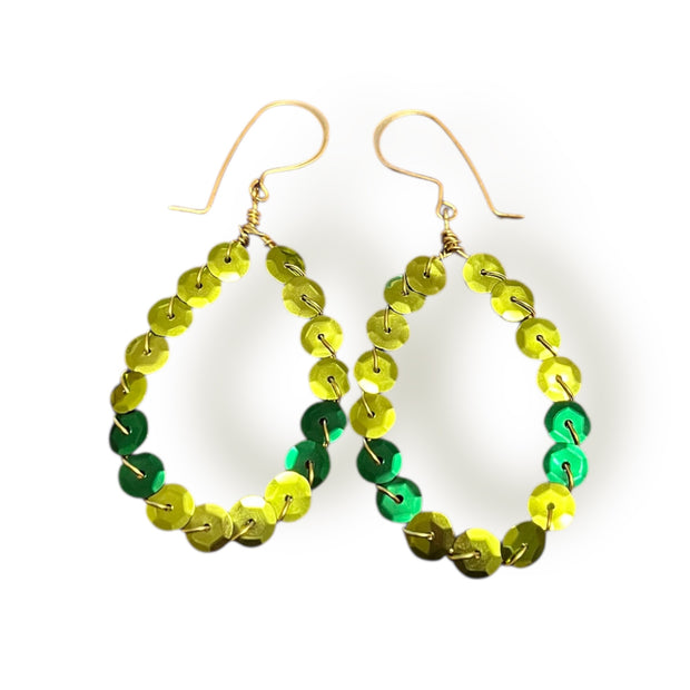 Green and yellow beaded hoop earrings on a white background