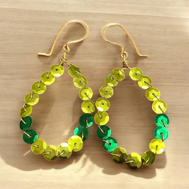 Elongated hoop earrings made with chartreuse and emerald green sequins.