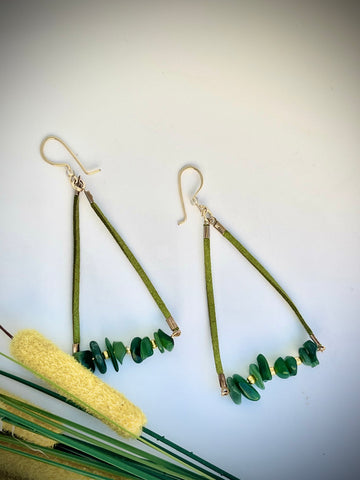 Triangular shaped hoop earrings made with green leather cord and green jade with gold tone earring wire.