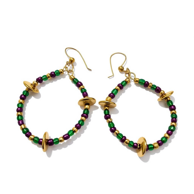 Hoop earrings with green, purple, and gold beads on a white background