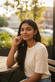 Woman sitting outdoors with a blurred background