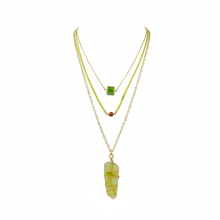 Two necklaces with green  glass and gemstones on a white background