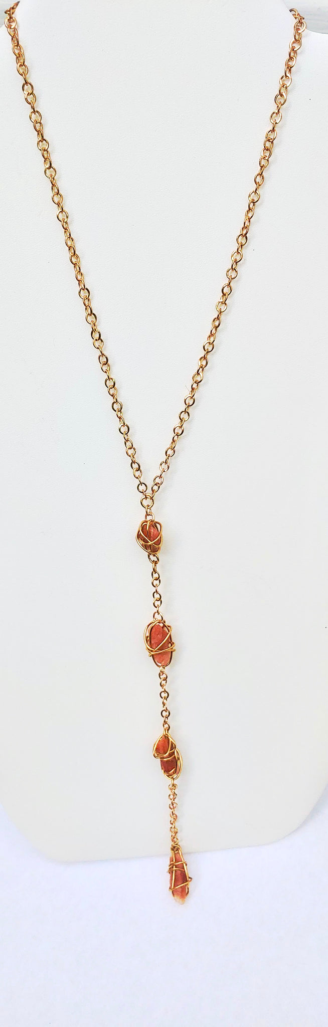 Long Necklace with sun stones wire wrapped in gold tone wire.  
