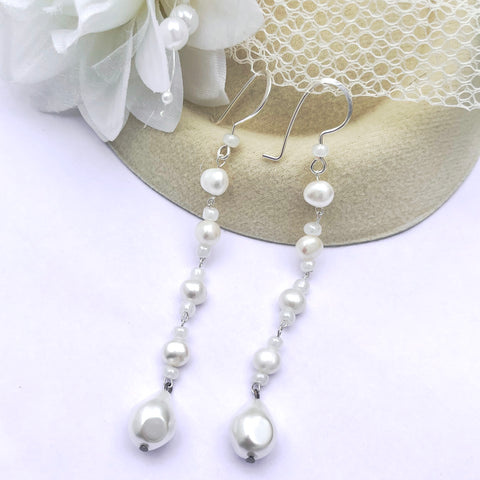 Dangle pearl earrings with freshwater pearls, glass seed beads, and a faux teardrop pearl.